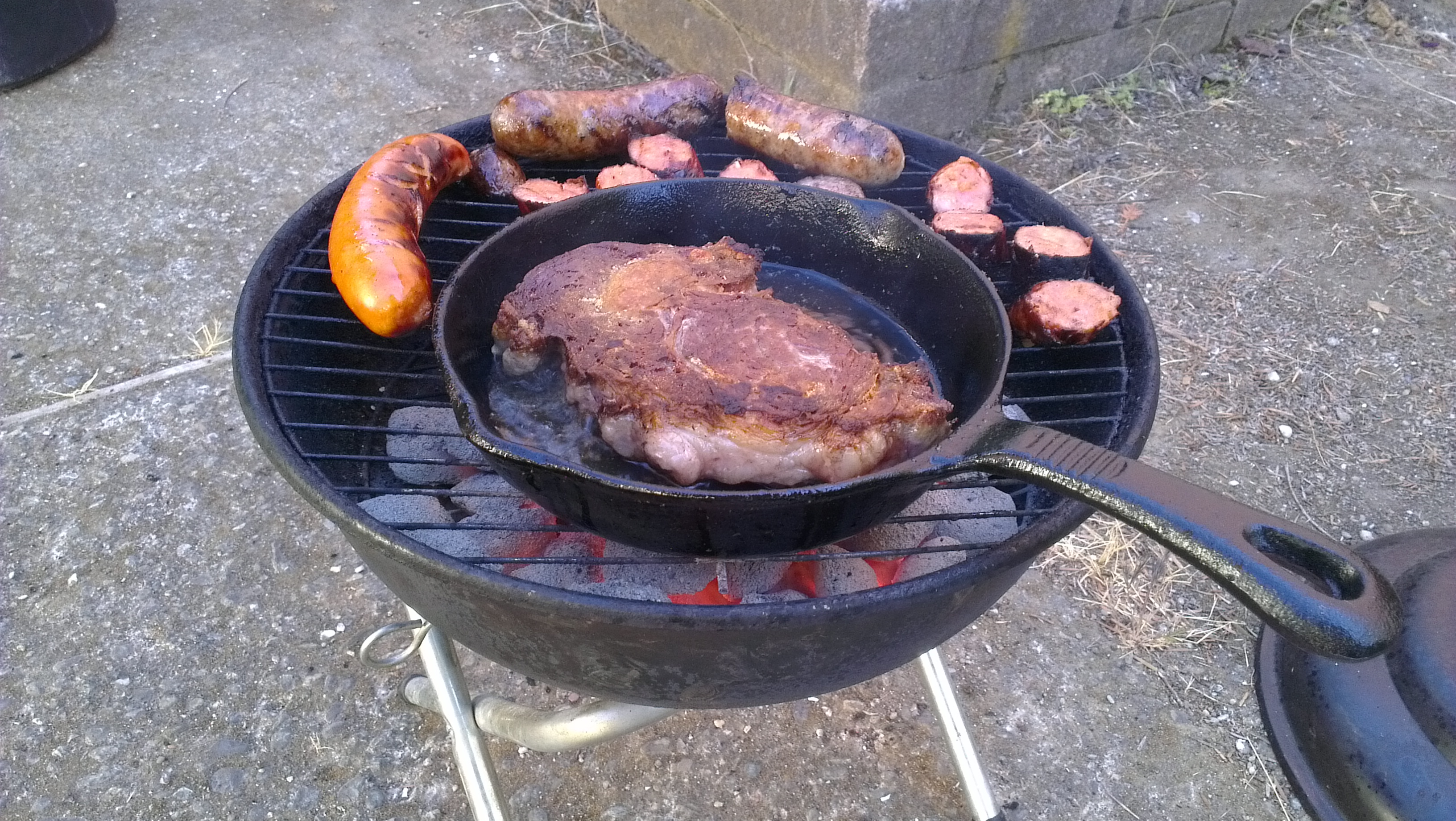 Steak and sausage on the grill